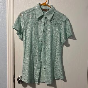 Women’s size medium foam green pearl snap shirt